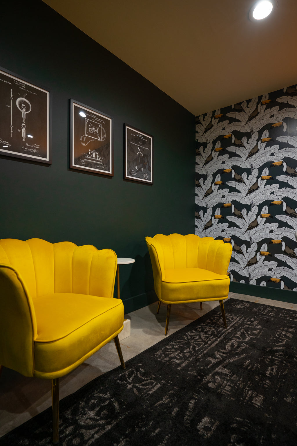 Bright yellow chairs on a dark wall