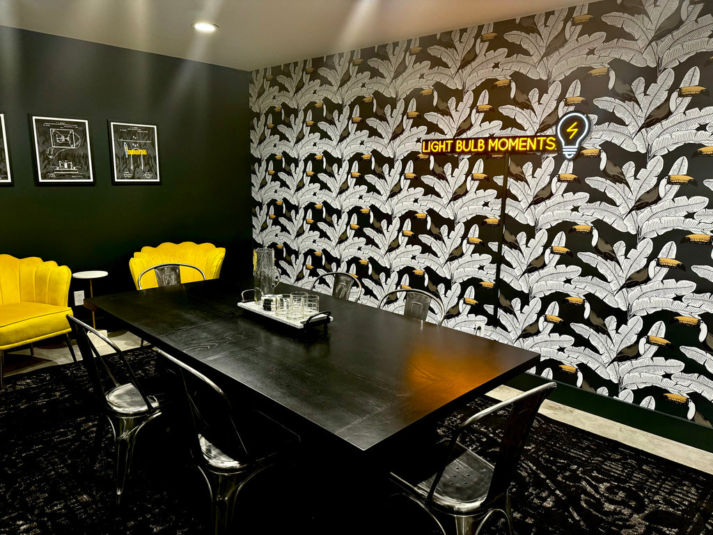 Conference room with black table and graphic wall paper